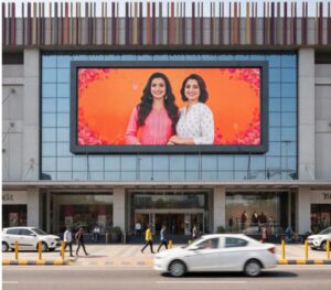 Large outdoor LED display signage on a retail mall building used for store branding and increasing retail store sales through high visibility digital signage.